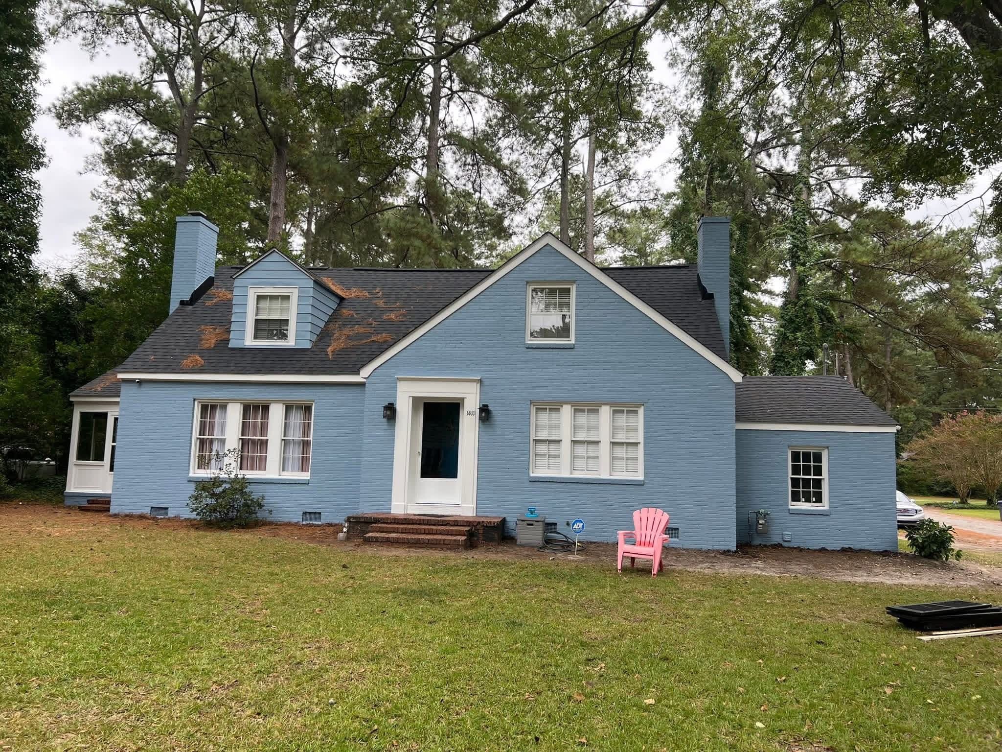 Full exterior repaint of residential home in Wilson NC — blue finish by Tacho Painting LLC