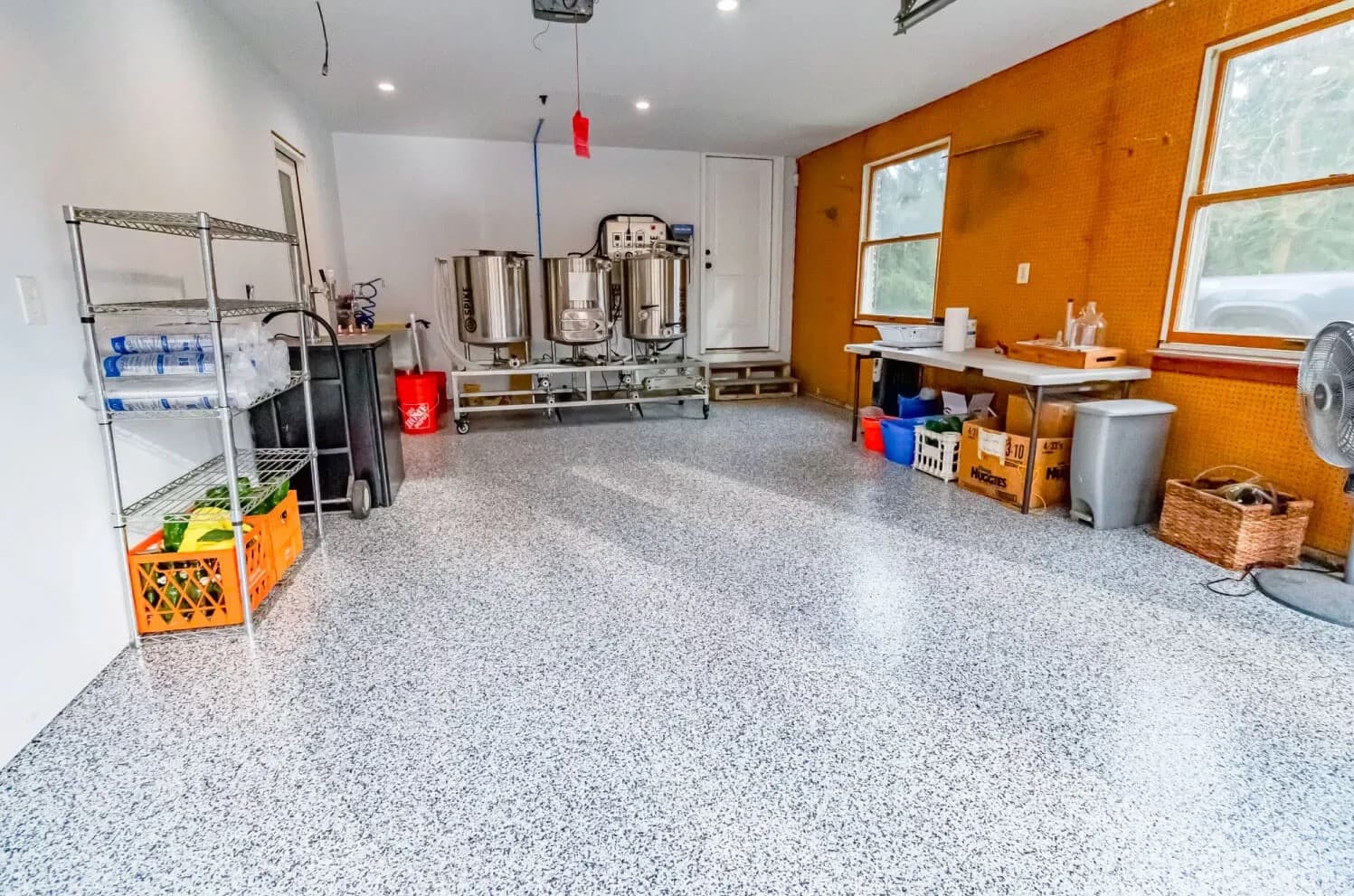 Commercial workspace epoxy floor coating with high-gloss finish by Tacho Painting LLC